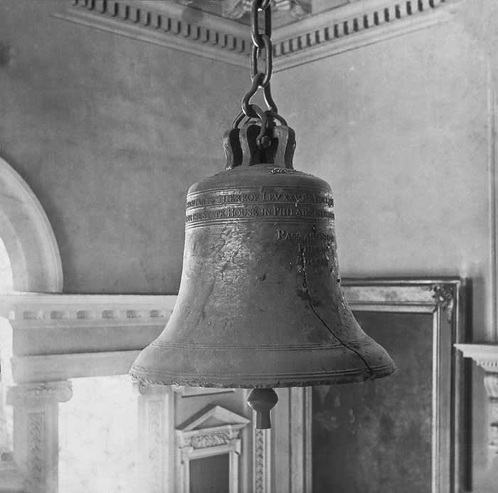 The cracked Liberty Bell, which was originally rung on the first public Declaration of Independence on 8th July 1776, hanging in in the steeple of the Pennsylvania State House in Philadelphia, Pennsylvania, United States. The bell was removed for safe keeping during the war. It was then rung on every 4th July from 1778 until 1835, when it cracked. Photo circa 1900. (Epics/Getty Images)