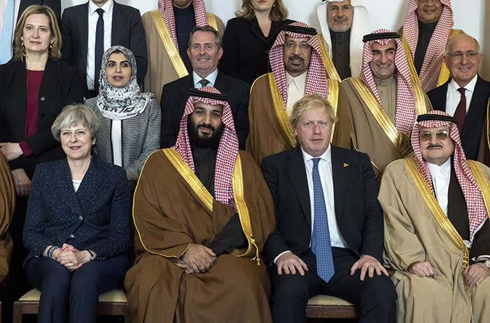 epa06587326 Britain's Prime Minister Theresa May (L) and Saudi Arabia's Crown Prince Mohammad bin Salman Al Saud (2-L) and British Foreign Secretary Boris Johnson (2-R) pose with other delegates and ministers for a photograph ahead of a series of meetings inside 10 Downing Street, Central London, Britain, 7 March 2018. The visit takes place during a three day visit to Britain by the Crown Prince and a delegation from Saudi Arabia . EPA/WILL OLIVER / POOL