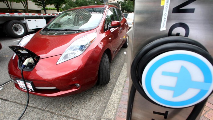 A Nissan Leaf charges at a electric vehicle charging station Thursday, Aug. 18, 2011, in Portland, Ore. More electric car fast-charging stations are coming to Oregon. The Oregon Department of Transportation announced Thursday that 22 of them will be built next year in the northwestern corner of the state. They will cover an area from Astoria to Florence, and from Hood River to Sisters with stations able to recharge an electric car in 30 minutes. That means electric cars will be able to extend their range from short commutes around the city to extended trips into the country.  (AP Photo/Rick Bowmer)