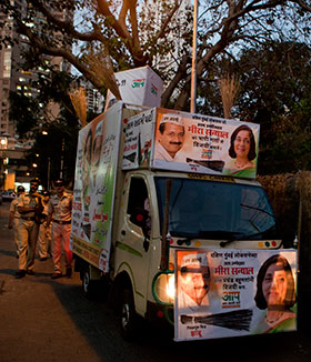 An AAP campaign truck on the streets of Mumbai, adorned with the brooms that symbolise the party’s mission to sweep away corruption