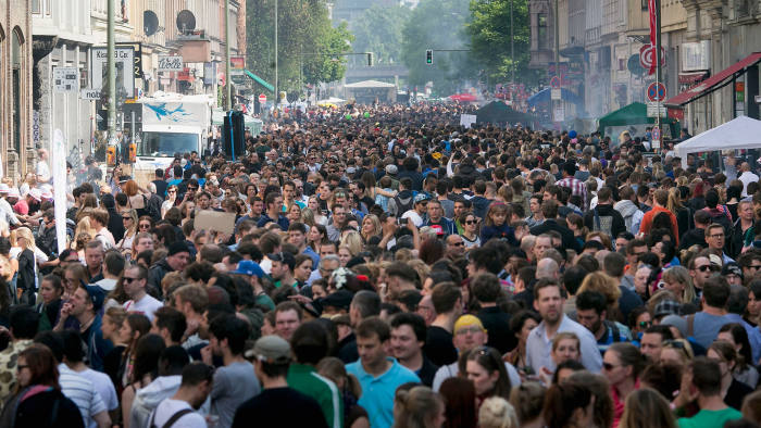 Crowds gather for a street festival in the Kreuzberg district, an area of Berlin with a large immigrant population, on May Day this year 
