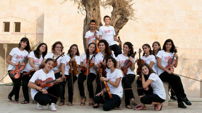 The Palestine Strings, whose players are aged between 12 and 22, at home before their visit to London this week 