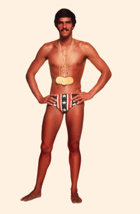 American swimmer Mark Spitz, circa 1973, with the seven gold medals that he won at the 1972 Munich Olympic Games