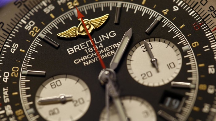 A Breitling logo sits on the face of a Chronomat 41 Airborne wristwatch, produced by Breitling SA, during the Baselworld luxury watch and jewelry fair in Basel, Switzerland, on Thursday, March 27, 2014. Over 1,400 companies from the watch, jewelry and gem industries will display their latest innovations and products to more than 120,000 visitors at this year's luxury show. Photographer: Gianluca Colla/Bloomberg