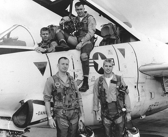 John McCain (Bottom R) poses with his U.S. Navy squadron in 1965. National Archives/Handout via REUTERS. ATTENTION - THIS IMAGE HAS BEEN SUPPLIED BY A THIRD PARTY - RC1DEE7B0B10