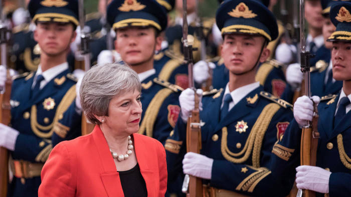 epa06487464 British Prime Minister Theresa May inspects the ceremonial guard at the Great Hall of the People in Beijing, China, 31 January 2018. May is leading the largest business delegation her government has ever taken overseas as she seeks to put her Brexit troubles aside and make progress on boosting British trade.  EPA/CHRIS RATCLIFFE / POOL