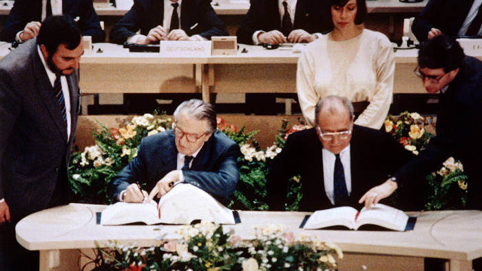 French foreign minister  Roland Dumas and French economy minister Pierre Bérégovoy sign the Maastricht  Treaty, which led to the creation of the euro, on February 7, 1992.