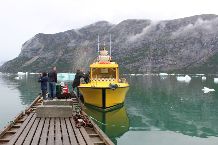 taxi boat arrives at the camp . credit Tom Robbins