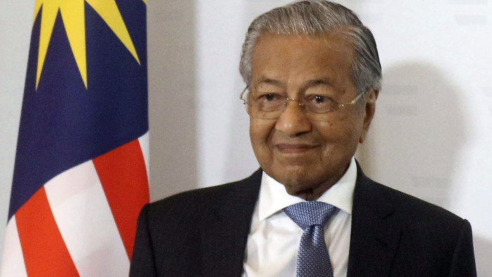 FILE - In this Monday, Jan. 21, 2019, file photo, Malaysia's Prime Minister Mahathir Mohamad arrives for meeting at the federal chancellery in Vienna, Austria. On Tuesday, Jan. 29, 2019, Mahathir says that proceeding with a multi-billion-dollar rail link project backed by China will ‚Äúimpoverish‚Äù the country, saddling it with heavy debts for the next 30 years. (AP Photo/Ronald Zak, File)