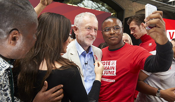 Opposition Labour Party leader Jeremy Corbyn (C) poses for a selfie at a final rally in favour of remaining in the EU in central london on June 22, 2016. European leaders warned Britain that a decision to leave the EU was irreversible, as the rival camps made a last-ditch push for votes on the eve of a too-close-to-call referendum that has set the continent on edge. / AFP / NIKLAS HALLE'N (Photo credit should read NIKLAS HALLE'N/AFP/Getty Images)