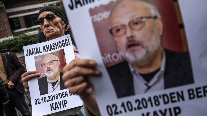 (FILES) This file photo taken on October 9, 2018 shows protesters holding portraits of missing journalist and Riyadh critic Jamal Khashoggi with the caption: "Jamal Khashoggi is missing since October 2" during a demonstration in front of the Saudi Arabian consulate in Istanbul. - Jamal Khashoggi went from being a Saudi royal family insider to an outspoken critic of the ultra-conservative kingdom's government. The Saudi journalist -- who was last seen on October 2 entering his country's consulate in Istanbul -- went into self-imposed exile in the United States in 2017 after falling out with Crown Prince Mohammed bin Salman. (Photo by OZAN KOSE / AFP)OZAN KOSE/AFP/Getty Images
