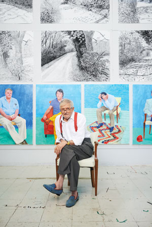 David Hockney in his LA studio with some of the works for his upcoming show. They include charcoal drawings of Yorkshire and portraits of friends, including assistant Jean-Pierre Goncalves De Lima (with head in hands)
