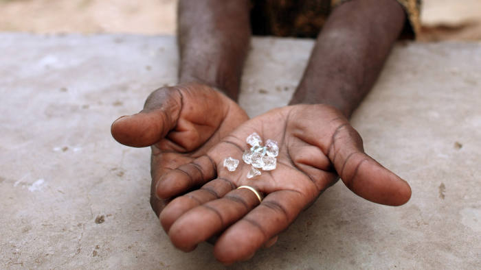 An illegal diamond dealer from Zimbabwe displays diamonds for sale in Manica...An illegal diamond dealer from Zimbabwe displays diamonds for sale in Manica, near the border with Zimbabwe, September 19, 2010. World Diamond Council president Eli Izhakoff said recently the flow of illicit diamonds was now less than 0.2 percent of global volumes. REUTERS/Goran Tomasevic (MOZAMBIQUE - Tags: SOCIETY) - RTXSF41
