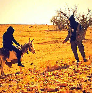 Ifthekar Jaman posing on a donkey in Syria with another British jihadist, who posted the picture on Twitter; as well as violent imagery, some of the social media content posted by young jihadis is striking for its ordinariness