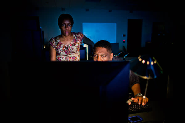 David Smith and Judith Barringer-Jenkins, both systems engineers at the Network Operations Center at the Lexis Nexis headquarters in Alpharetta, Georgia