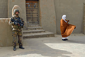 A French soldier stands guard in front of Timbuktu’s Djingereyber mosque in January
