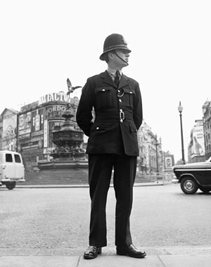 A UK police officer on duty in Piccadilly in 1963