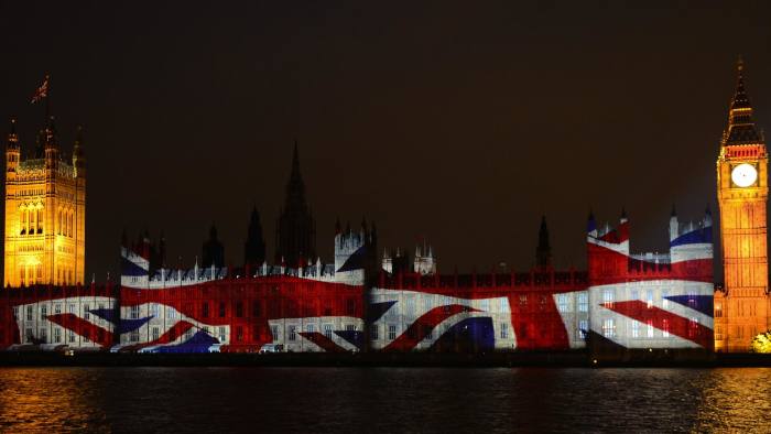 An image of the Union flag is projected on The Houses of Parliament in London on July 27, 2012, during the opening ceremony of the London 2012 Olympic Games. AFP PHOTO/ERIC FEFERBERG (Photo credit should read ERIC FEFERBERG/AFP/GettyImages)