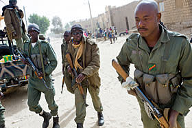 Malian soldiers patrol the streets in the wake of the French-led offensive