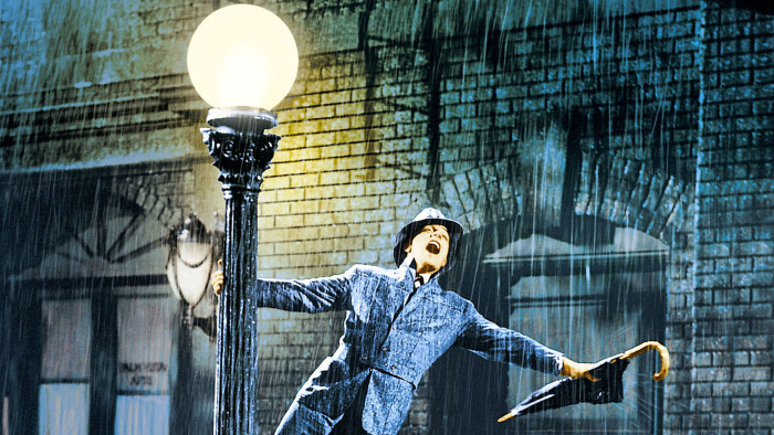 Gene Kelly hangs off a street light in 1952 film ‘Singin’ in the Rain’