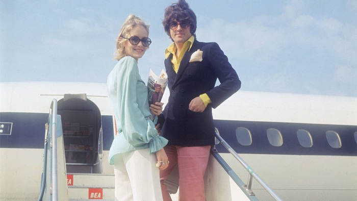 model Twiggy and her partner and manager Justin de Villeneuve boarding a BEA aircraft