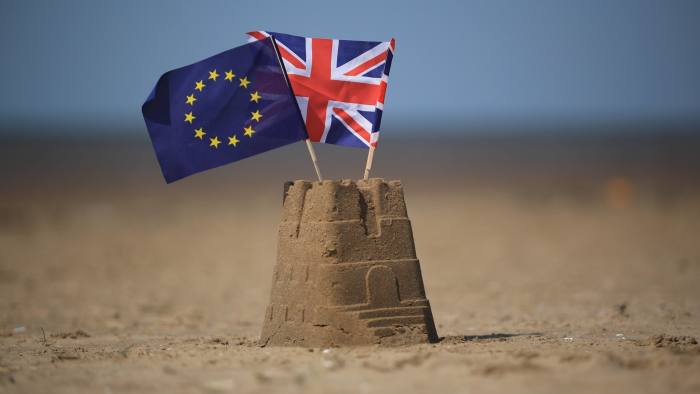 SOUTHPORT, UNITED KINGDOM - MAY 09:  In this photo illustration the flag of the European Union and the Union flag sit on top of a sand castle on a beach on May 09, 2016 in Southport, United Kingdom. The United Kingdom  will hold a referendum on June 23, 2016 to decide whether or not to remain a member of the European Union (EU), an economic and political partnership involving 28 European countries which allows members to trade together in a single market and free movement across it's borders for cirtizens.  (Photo by illustration by Christopher Furlong/Getty Images)