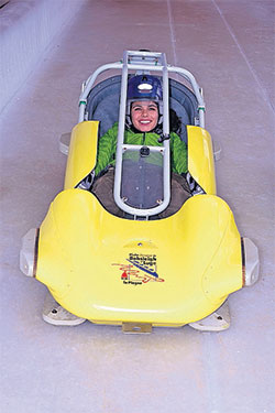 Speed luge with protective cage