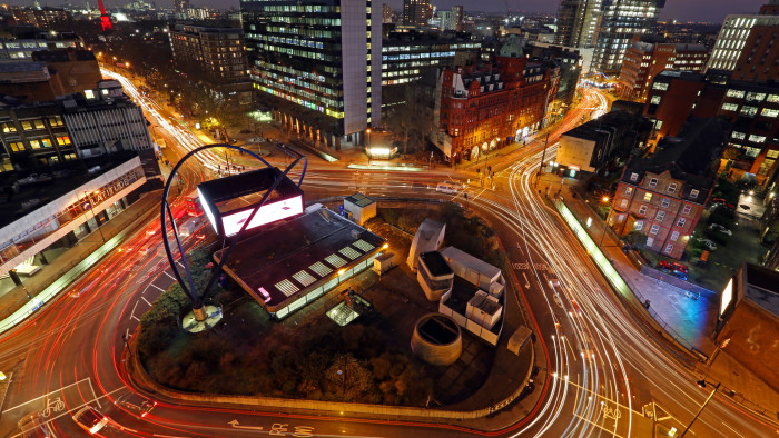 Light trails from traffic are seen as they pass around the Old Street roundabout, in the area known as London's Tech City, in London, U.K., on Tuesday, Dec. 17, 2013. The U.K government last year pledged 50 million pounds for a new London startup incubator, and hired ex-Facebook Inc. executive Joanna Shields to promote Tech City, with Google Inc., Amazon.com Inc., and Cisco Systems Inc. all having taken space in the area or planning to do so. Photographer: Chris Ratcliffe/Bloomberg