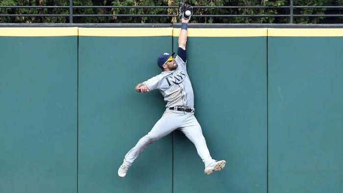 May 17, 2017; Cleveland, OH, USA; Tampa Bay Rays center fielder Kevin Kiermaier (39) makes a catch at the wall of a ball hit by Cleveland Indians second baseman Jason Kipnis during the ninth inning at Progressive Field. Mandatory Credit: Ken Blaze-USA TODAY Sports TPX IMAGES OF THE DAY - RC12D652A100