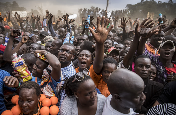 Supporters react during a speech by Raila Odinga, opposition leader for the National Super Alliance (NASA), not pictured, during a political rally in Nairobi, Kenya, on Wednesday, Oct. 18, 2017. Kenya is repeating its Aug. 8 presidential election after the Supreme Court last month overturned President Uhuru Kenyatta’s victory, saying the vote wasn’t conducted in line with the constitution and the Independent Electoral & Boundaries Commission’s systems were “infiltrated and compromised.” Photographer: Luis Tato/Bloomberg