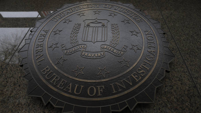 The FBI seal and motto are seen at of the J. Edgar Hoover Federal Bureau of Investigation (FBI) Building in Washington, U.S., February 1, 2018. U.S. President Donald Trump is expected to announce soon that he will release a controversial memo that purports to show bias against him at the FBI and Justice Department as they investigated contacts between Trump's presidential campaign and Russia. REUTERS/Jim Bourg