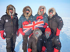 Jim Ratcliffe (standing second from right) at the North Pole with his sons Sam (on his right) and George (in front of them)