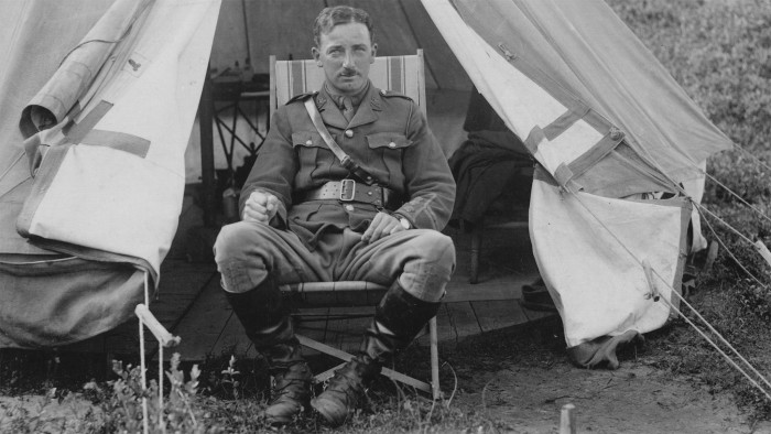 Captain Charlie May outside his tent during training on Salisbury Plain, England