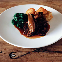 Tom Kerridge's slow roast venison haunch with shallots, cranberries and chestnuts