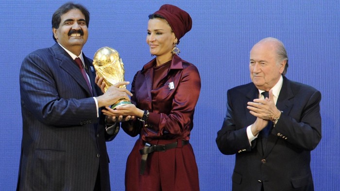 Emir of the State of Qatar Sheikh Hamad bin Khalifa Al-Thani (R) and his wife Sheikha Moza bint Nasser Al-Missned (C) receive the World Cup trophy from Fifa President Joseph Blatter after the official announcement that Qatar will host the 2022 World Cup on December 2, 2010 at the FIFA headquarters in Zurich. AFP PHOTO / FABRICE COFFRINI (Photo credit should read FABRICE COFFRINI/AFP/Getty Images)