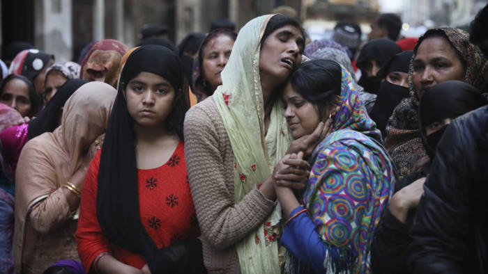 Relatives and neighbors wail near the body of Mohammad Mudasir, 31, who was killed in communal violence in New Delhi, India, Thursday, Feb. 27, 2020. The violent clashes between Hindu and Muslim mobs were the capital's worst communal riots in decades and saw shops, Muslim shrines and public vehicles go up in flames. (AP Photo/Manish Swarup)