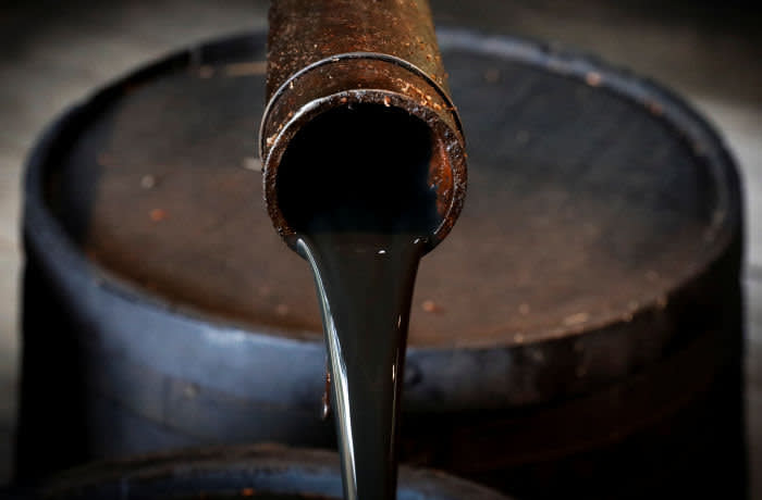 Oil pours out of a spout from Edwin Drake's original 1859 well that launched the modern petroleum industry at the Drake Well Museum and Park in Titusville, Pennsylvania U.S., October 5, 2017. REUTERS/Brendan McDermid - RC1774F075E0