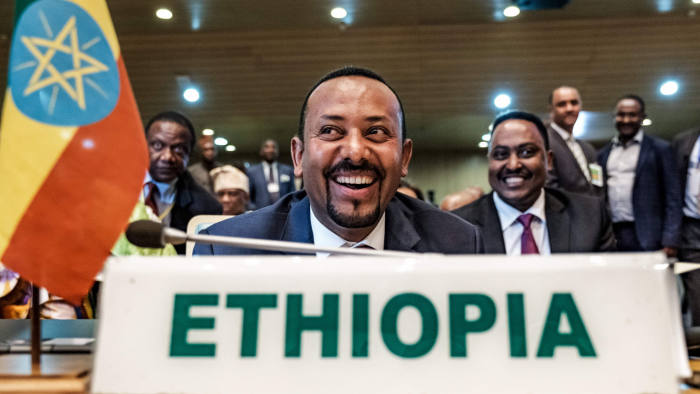 (FILES) In this file photo taken on January 17, 2019 Ethiopia's Prime Minister Abiy Ahmed (C) smiles before a High Level Consultation Meeting with African leaders on DR Congo election at the AU headquarters in Addis Ababa. - Ethiopian Prime Minister Abiy Ahmed was awarded the Nobel Peace Prize for his efforts to resolve his country's conflict with bitter foe Eritrea, the Nobel Committee announced in Oslo on October 11, 2019 (Photo by EDUARDO SOTERAS / AFP) (Photo by EDUARDO SOTERAS/AFP via Getty Images)