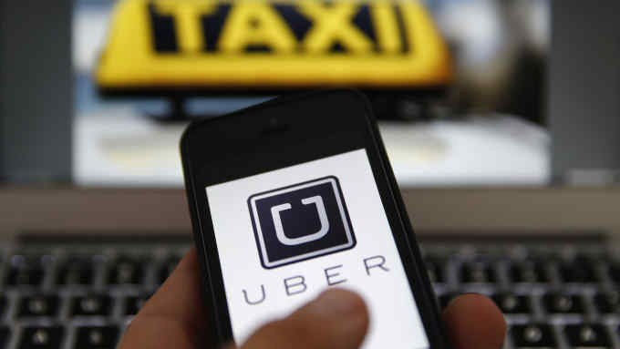 PLEASE NOTE: THIS IS OLD LOGO An illustration picture shows the logo of car-sharing service app Uber on a smartphone next to the picture of an official German taxi sign...An illustration picture shows the logo of car-sharing service app Uber on a smartphone next to the picture of an official German taxi sign in Frankfurt, September 15, 2014. A Frankfurt high court will hold a hearing on a recent lawsuit brought against Uberpop by Taxi Deutschland on Tuesday. San Francisco-based Uber, which allows users to summon taxi-like services on their smartphones, offers two main services, Uber, its classic low-cost, limousine pick-up service, and Uberpop, a newer ride-sharing service, which connects private drivers to passengers - an established practice in Germany that nonetheless operates in a legal grey area of rules governing commercial transportation. The company has faced regulatory scrutiny and court injunctions from its early days, even as it has expanded rapidly into roughly 150 cities around the world. REUTERS/Kai Pfaffenbach (GERMANY - Tags: BUSINESS EMPLOYMENT CRIME LAW TRANSPORT)