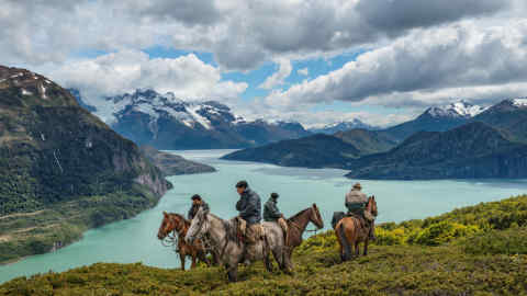 JX7BB8 Bagualeros, cowboys who capture feral livestock, pause in their search for cattle on Antonio Varas Peninsula.