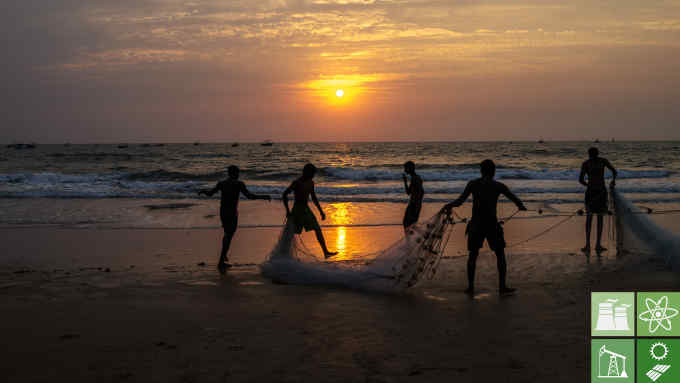 Local fisherman pack a fishing net as the sun sets in Goa, India. Photograph: Sanjit Das/Bloomberg