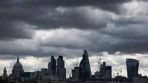 Clouds gather about City of London skyscrapers, following Saturday night's terror attack, in London, U.K., on Monday, June 5, 2017. Police are stepping up drills and security on the streets as the challenge facing them continues to shift. Photographer: Luke MacGregor/Bloomberg