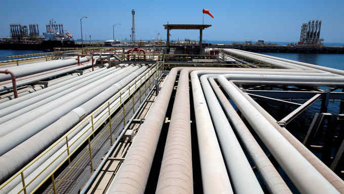 FILE PHOTO: An oil tanker is being loaded at Saudi Aramco's Ras Tanura oil refinery and oil terminal in Saudi Arabia, May 21, 2018. REUTERS/Ahmed Jadallah/File Photo
