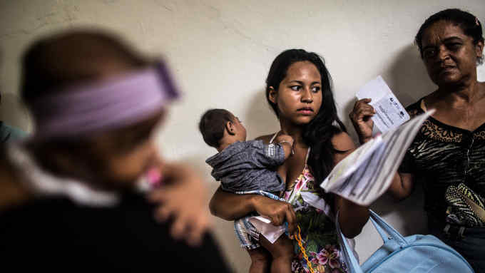 Rafaela Souza Lima, 17, a student from the city of Inajá holds her son Marcos Guilherme, born in July 2015 as she tries to schedule a tomography for him at a hospital in Recife, Brazil, Wednesday, January, 20, 2016. The city has been the national epicenter of hundreds of cases of microcephaly linked to a Zika virus outbreak that has its roots on poor sanitation, unattended garbage and urban sprawl. These factors contribute to Aedes aegypt mosquitoes' proliferation and along with them the viruses that use it as vector, like dengue, zika and chikungunya. (Hilaea Media/Dado Galdieri for Financial Times)