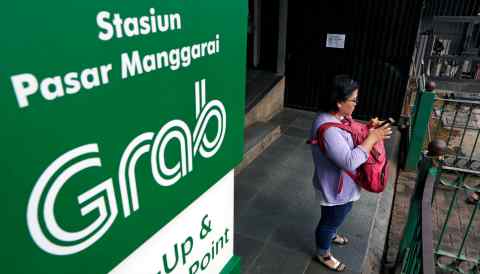 The pickup and drop-off point for the online ride-hailing service Grab at the Manggarai train station in Jakarta.