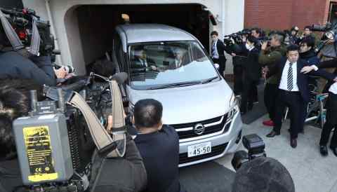 A vehicle believed to be carrying Carlos Ghosn leaves his residence in Tokyo on April 4.