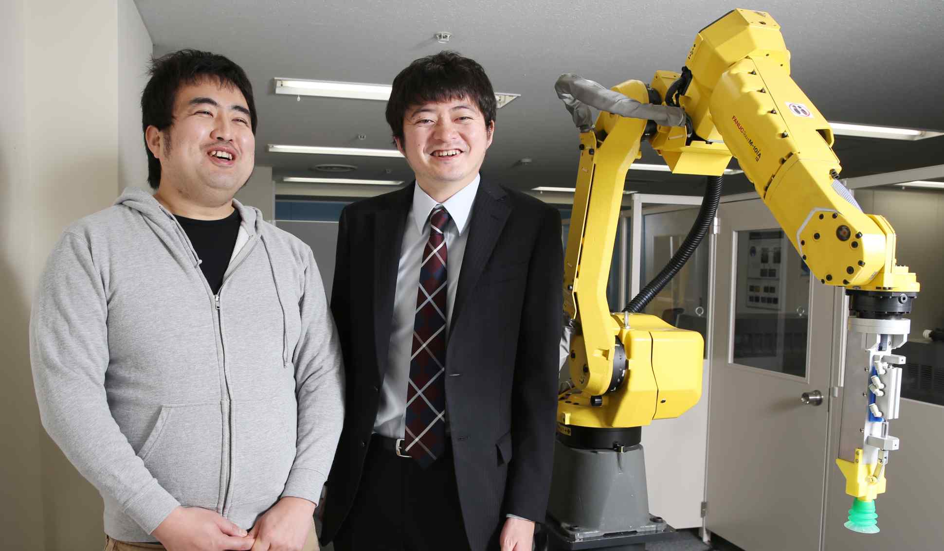 oru Nishikawa and Daisuke Okanohara in the lab
