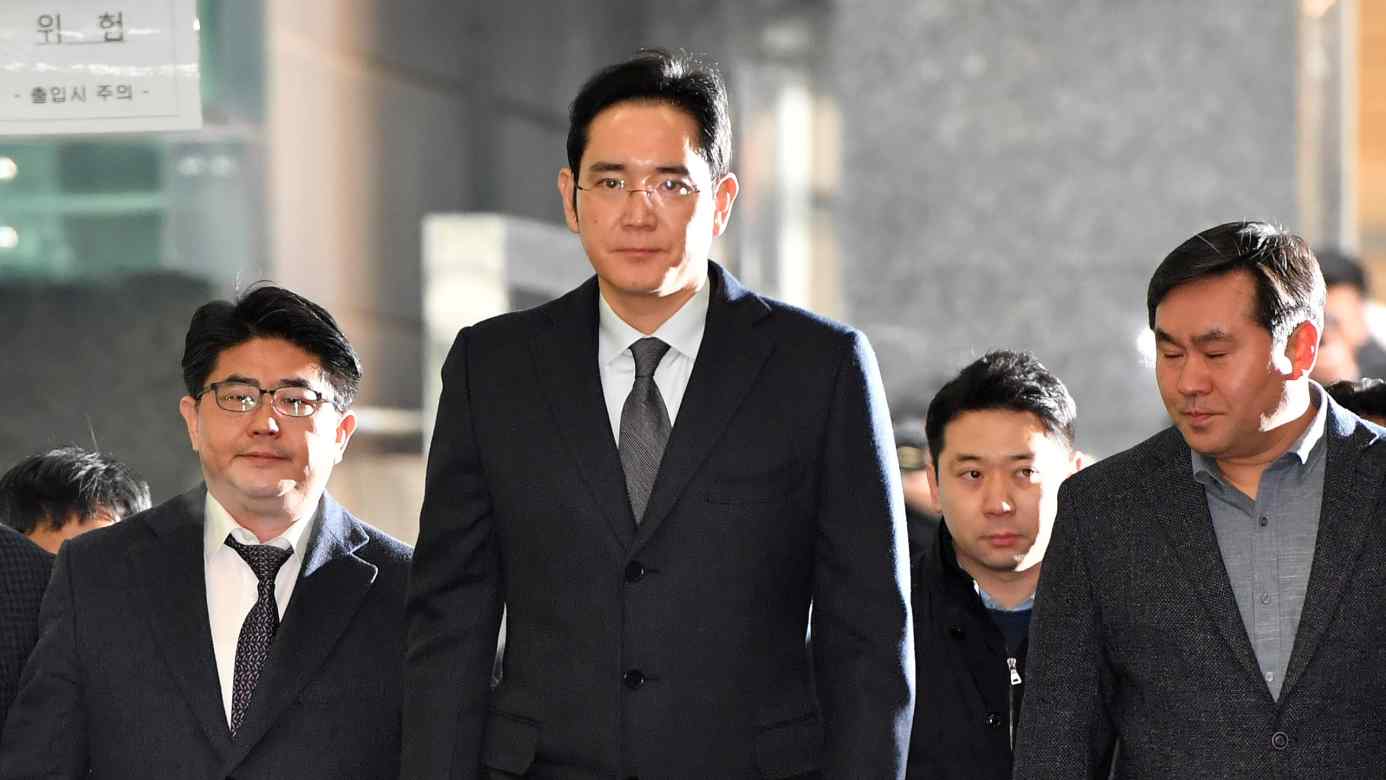 Samsung Electronics heir apparent Lee Jae-yong, center, has kept a low profile since being released from prison in February.