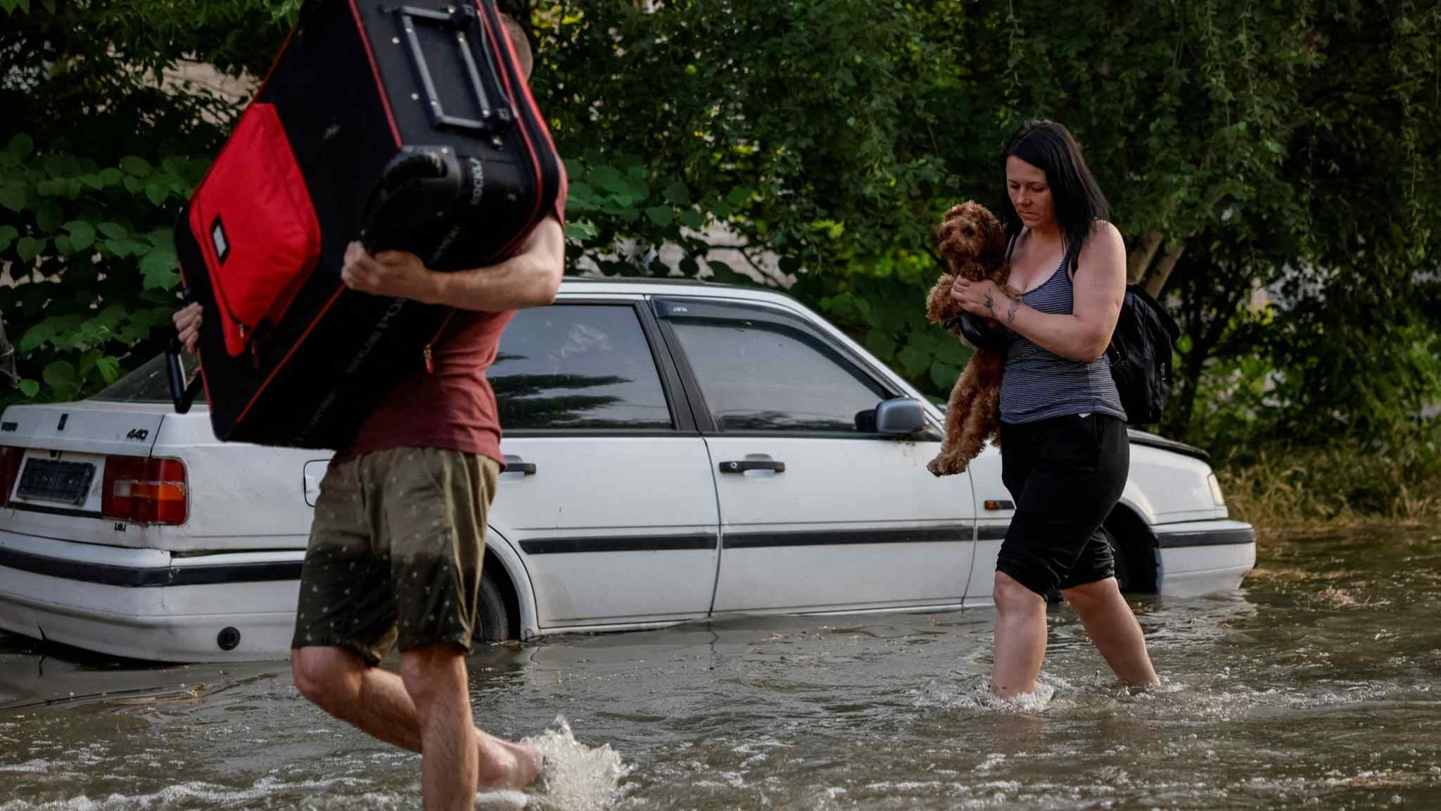 Evacuations under way in southern Ukraine as flooding hits dozens of towns