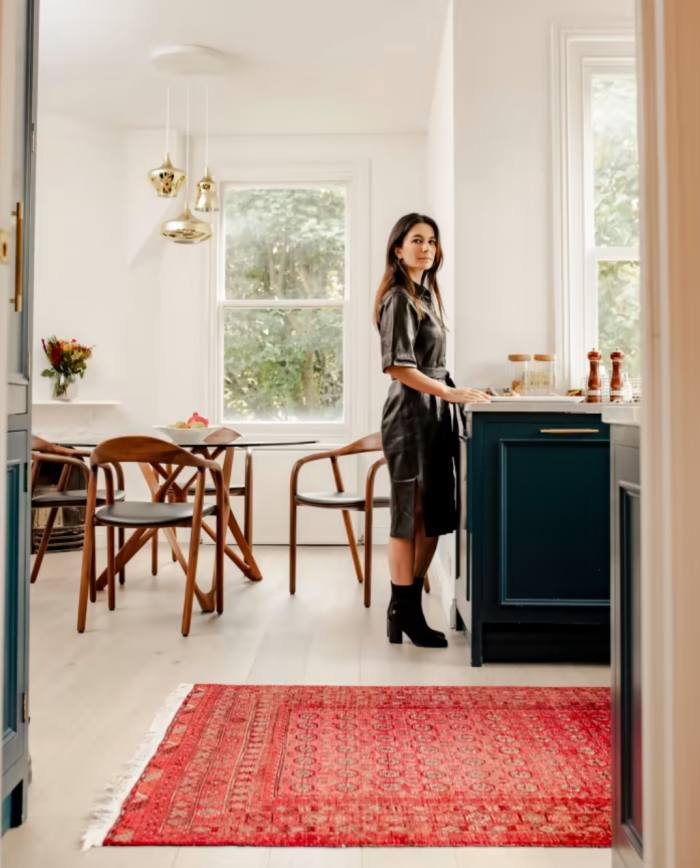 BBC World News presenter Yalda Hakim in her kitchen next to her Afghan rug